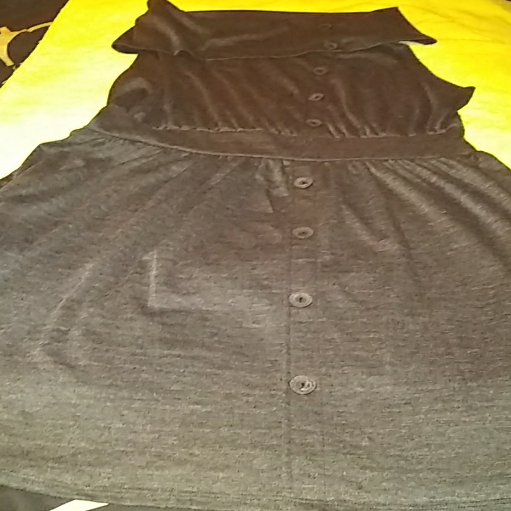 A grey dress with buttons down the front
